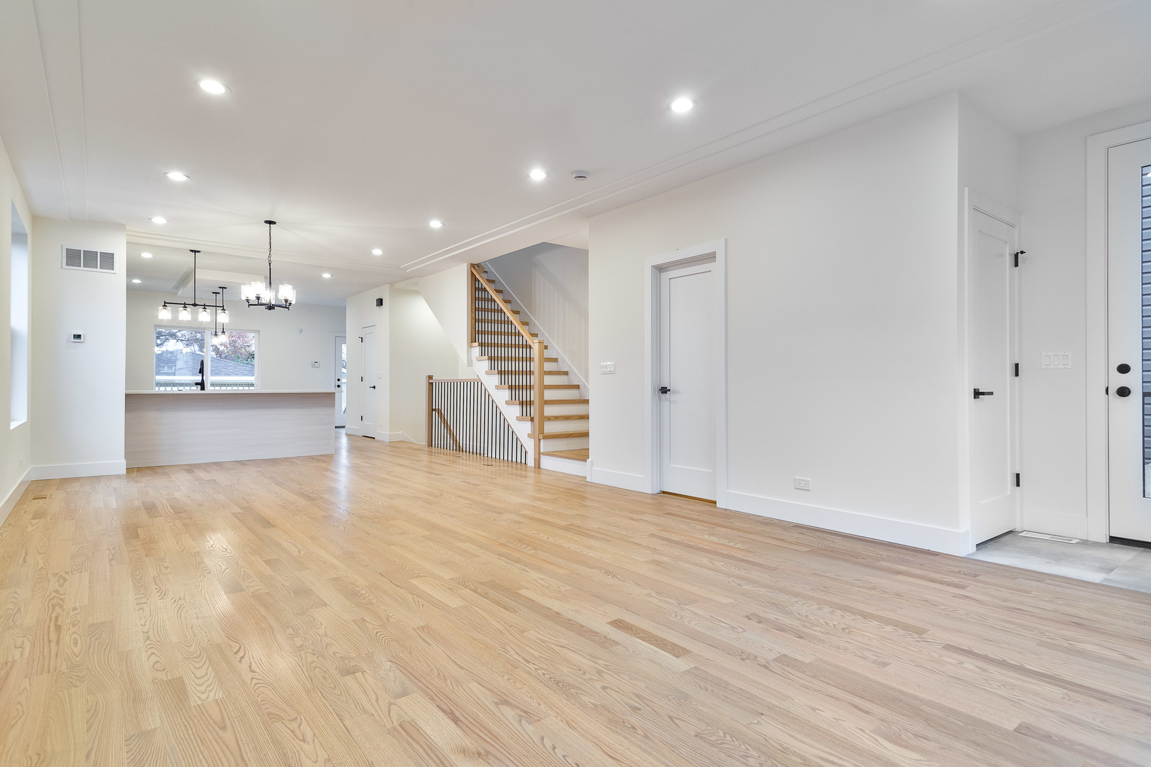 3015 North Normandy Avenue Chicago, IL 60634 - Photo 9 of 28 a view of an empty room with wooden floor