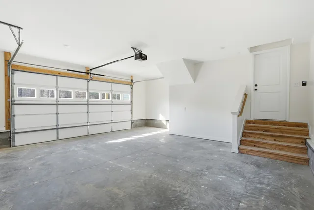 a bathroom with a double vanity sink mirror and shower