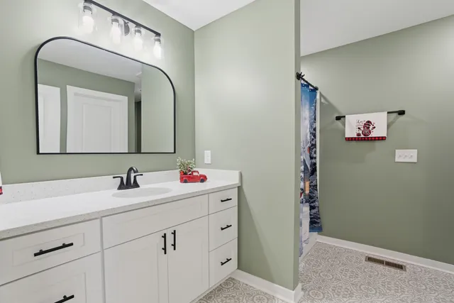 a kitchen with a sink stove and refrigerator