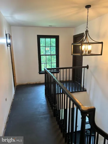 a view of a hallway with windows