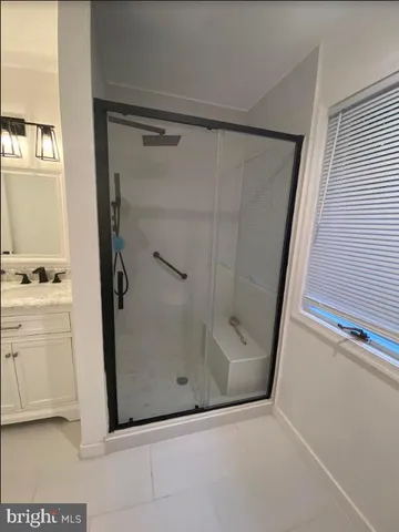 a bedroom with a bed and a mirror