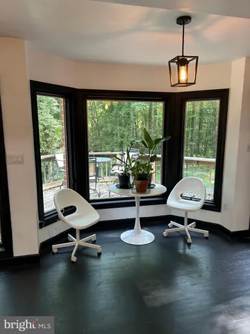 a large kitchen with kitchen island a sink stainless steel appliances and a counter top