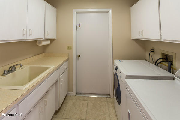 499 Winchester Road Satellite Beach, FL 32937 - Photo 22 of 24 Interior Oversized Laundry Room