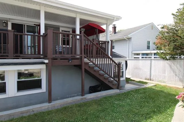 a view of a two chairs in the balcony