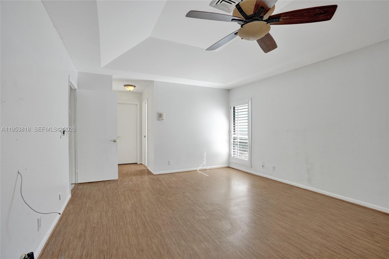 17115 Bay Street Jupiter, FL 33477 - Photo 25 of 73 wooden floor in an empty room with a window