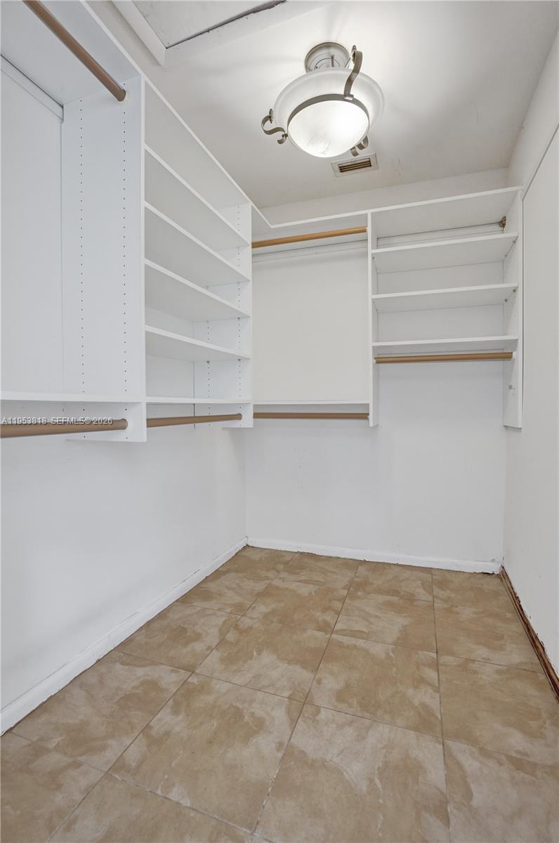 17115 Bay Street Jupiter, FL 33477 - Photo 31 of 73 a view of a room with shelf
