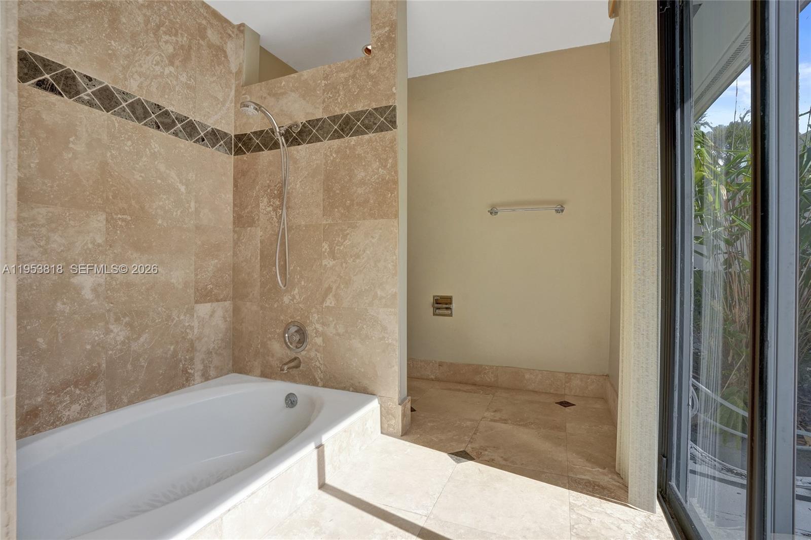 17115 Bay Street Jupiter, FL 33477 - Photo 36 of 73 a bathroom with a tub shower and sink