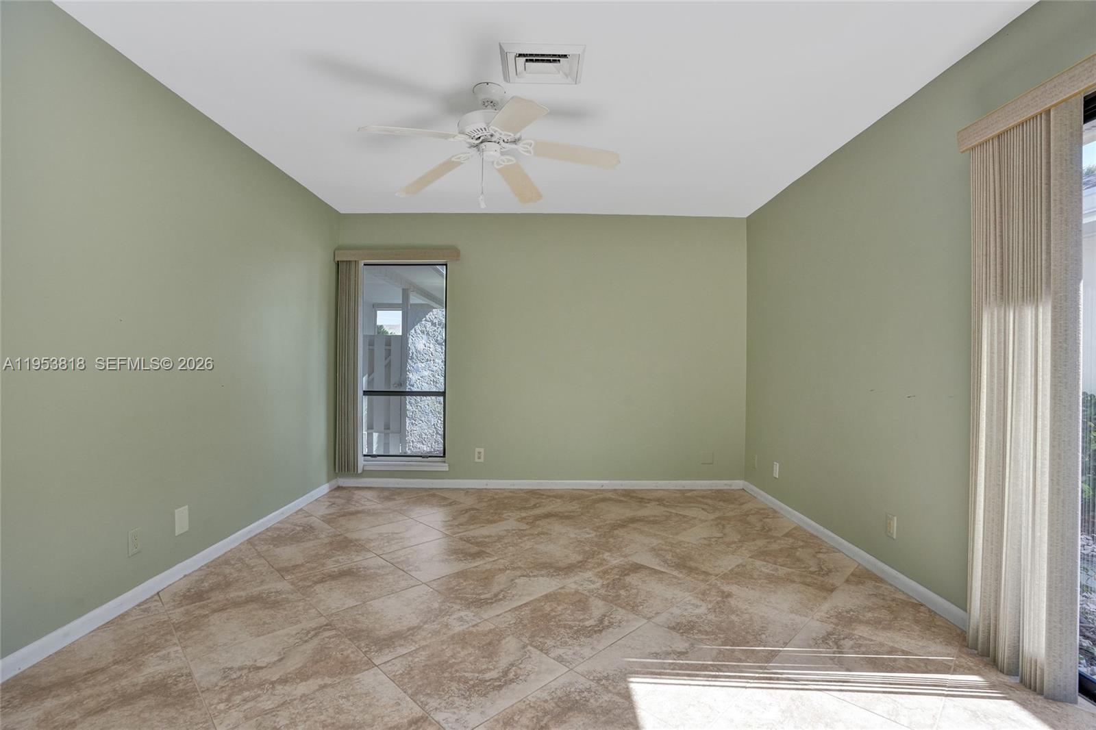17115 Bay Street Jupiter, FL 33477 - Photo 40 of 73 a view of an empty room with a window
