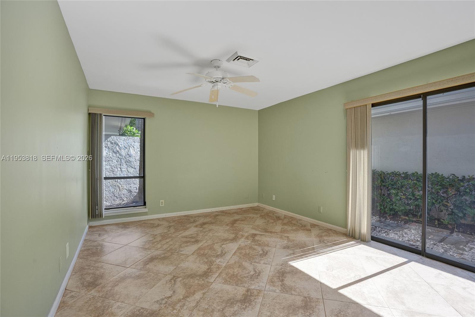 17115 Bay Street Jupiter, FL 33477 - Photo 41 of 73 a view of room with window and ceiling fan