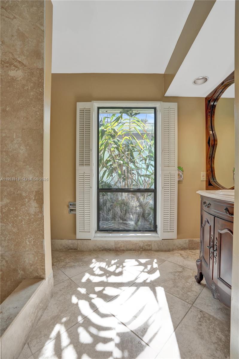 17115 Bay Street Jupiter, FL 33477 - Photo 44 of 73 a bedroom with a bed and a window