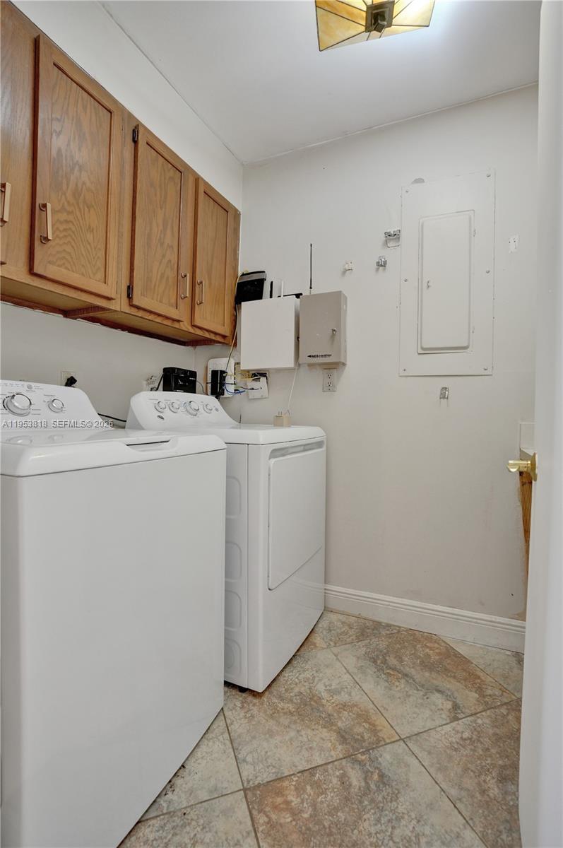 17115 Bay Street Jupiter, FL 33477 - Photo 46 of 73 a utility room with closet dryer and washer