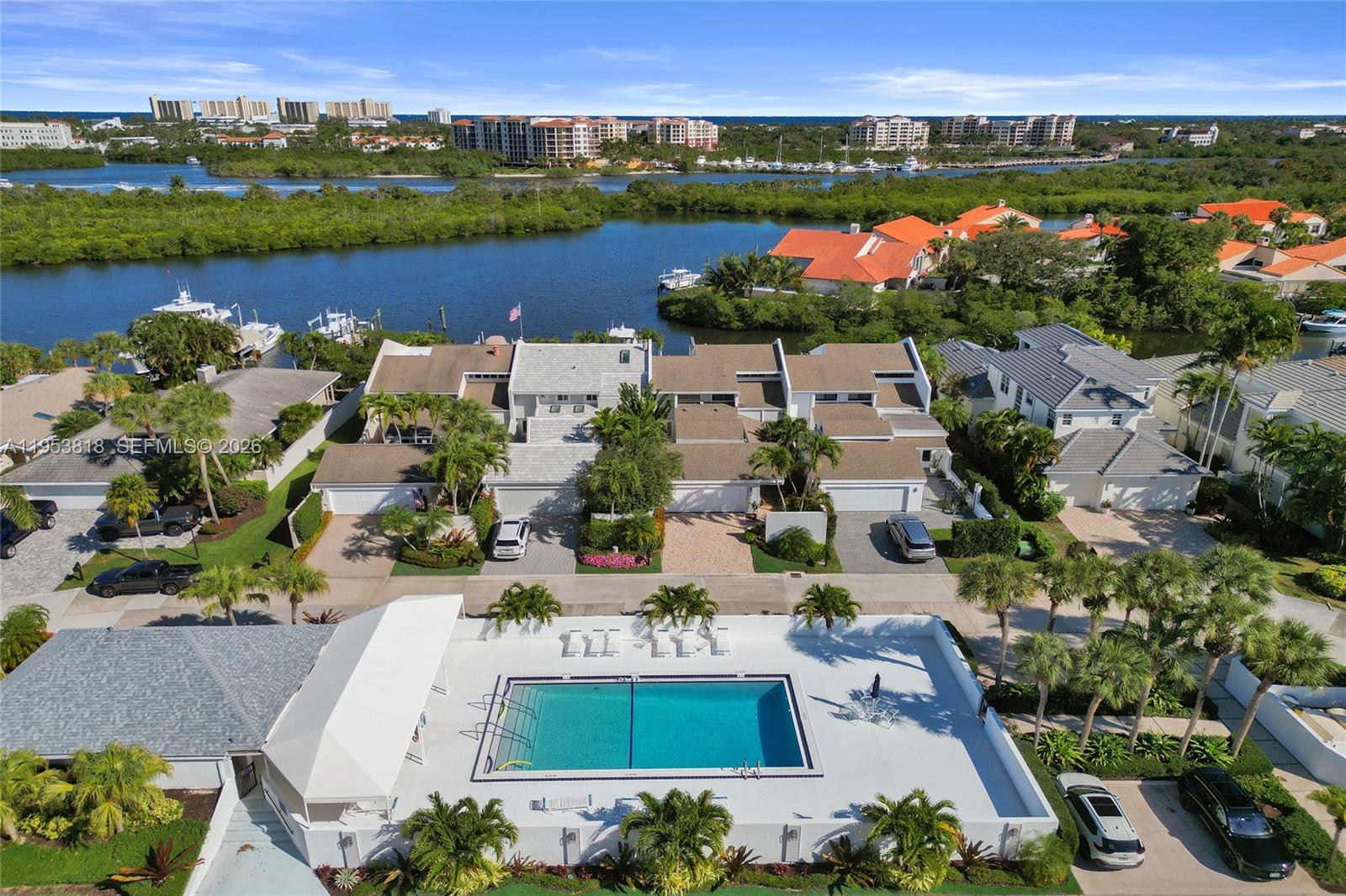 17115 Bay Street Jupiter, FL 33477 - Photo 53 of 73 an aerial view of house with yard swimming pool and lake view