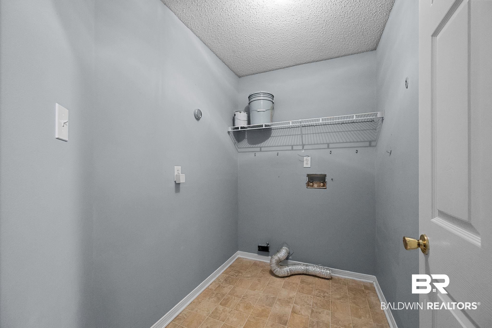 3744 Pepper Ridge Drive Mobile, AL 36693 - Photo 27 of 29 Laundry room featuring a textured ceiling and washer hookup