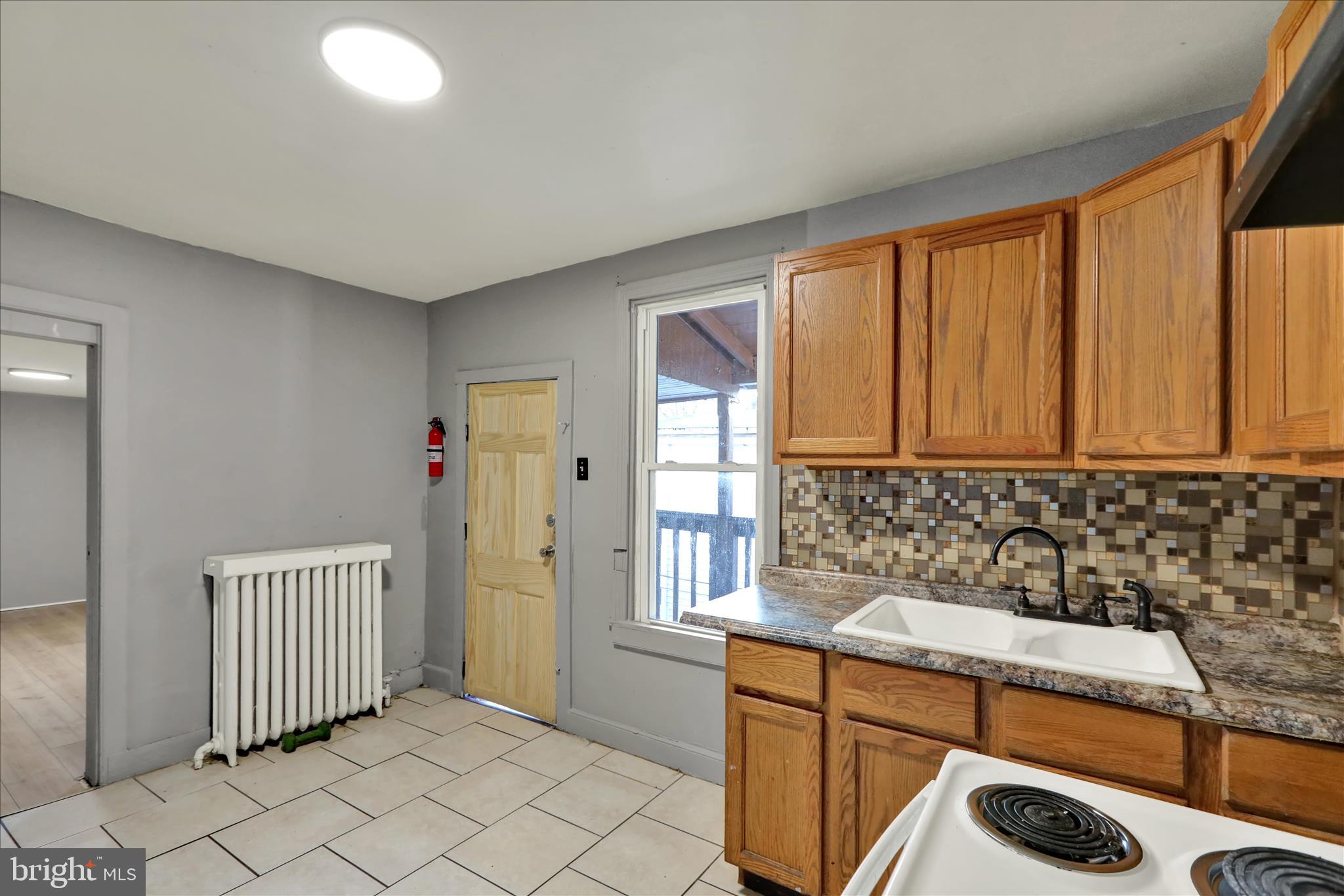 1410 Cotton Street Reading, PA 19602 - Photo 17 of 37 a bathroom with a sink and a bathtub