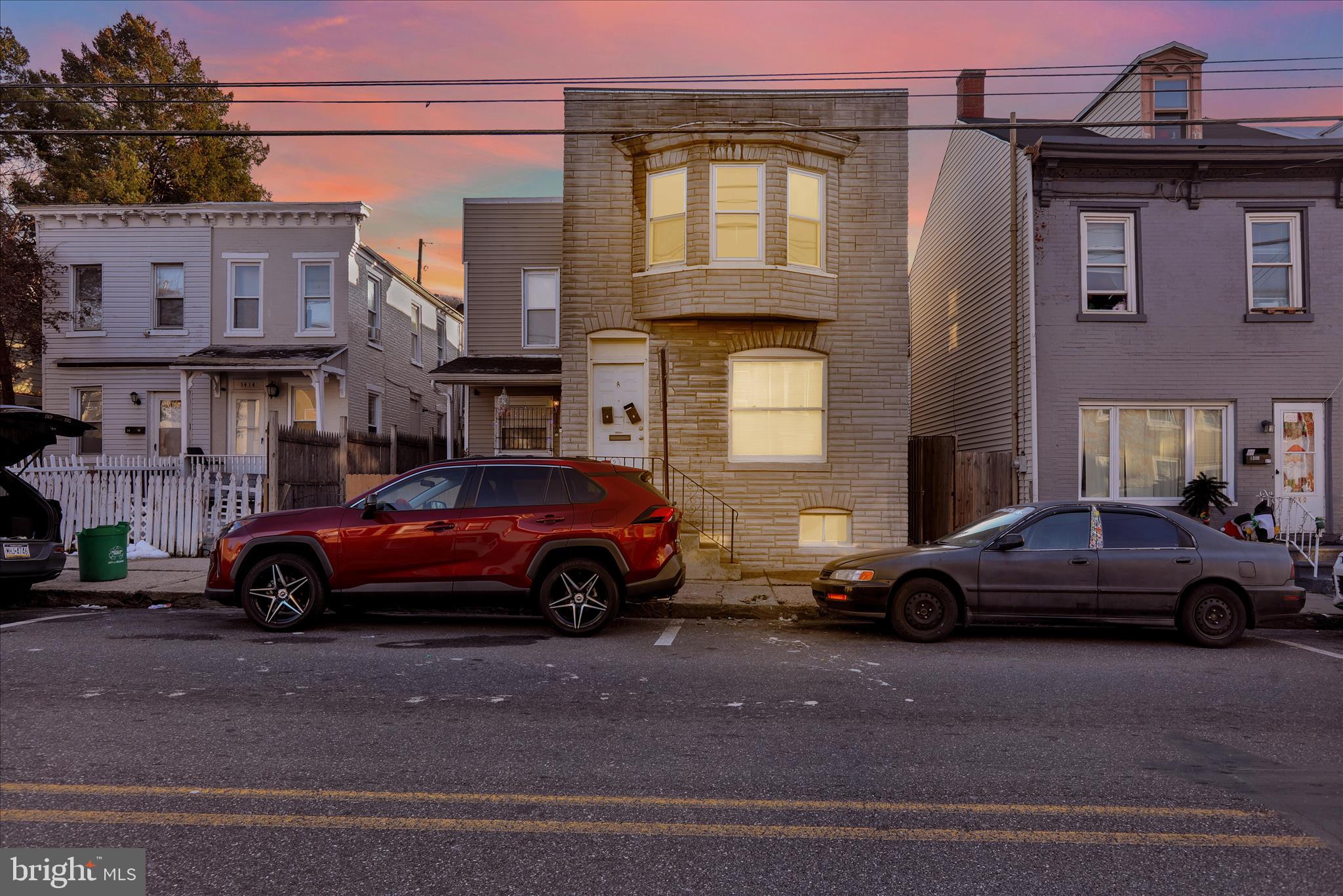 1410 Cotton Street Reading, PA 19602 - Photo 2 of 37 a view of a car parked in front of a brick house