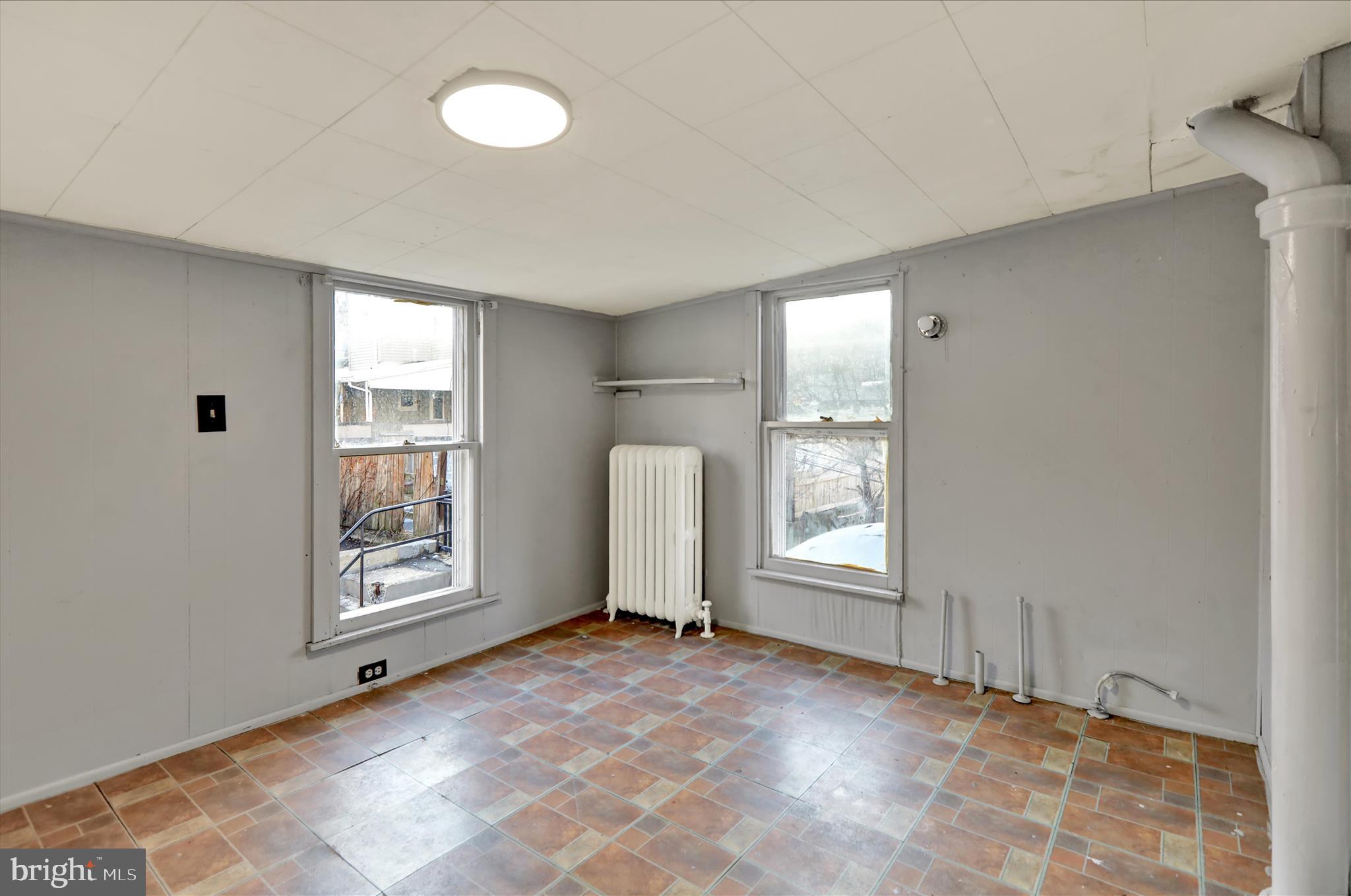 1410 Cotton Street Reading, PA 19602 - Photo 27 of 37 a view of an empty room with a window