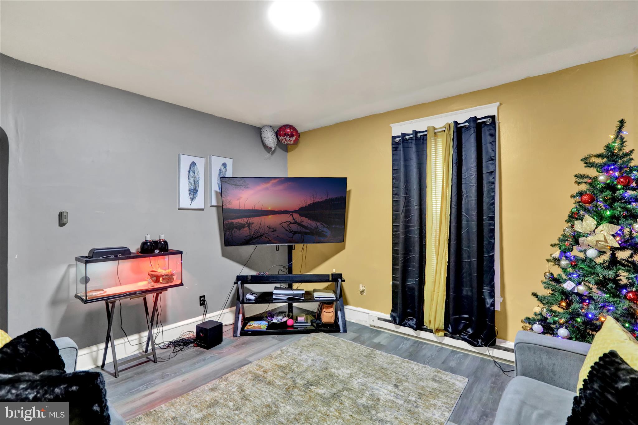 1410 Cotton Street Reading, PA 19602 - Photo 4 of 37 a living room with furniture and a flat screen tv