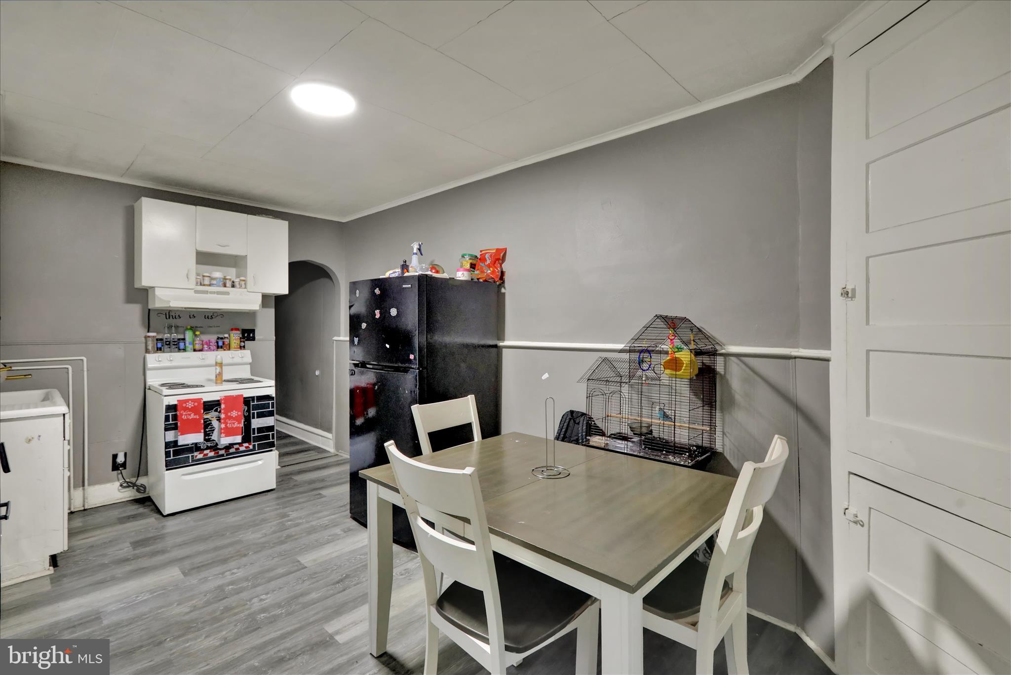 1410 Cotton Street Reading, PA 19602 - Photo 6 of 37 a view of a dining room with furniture and wooden floor