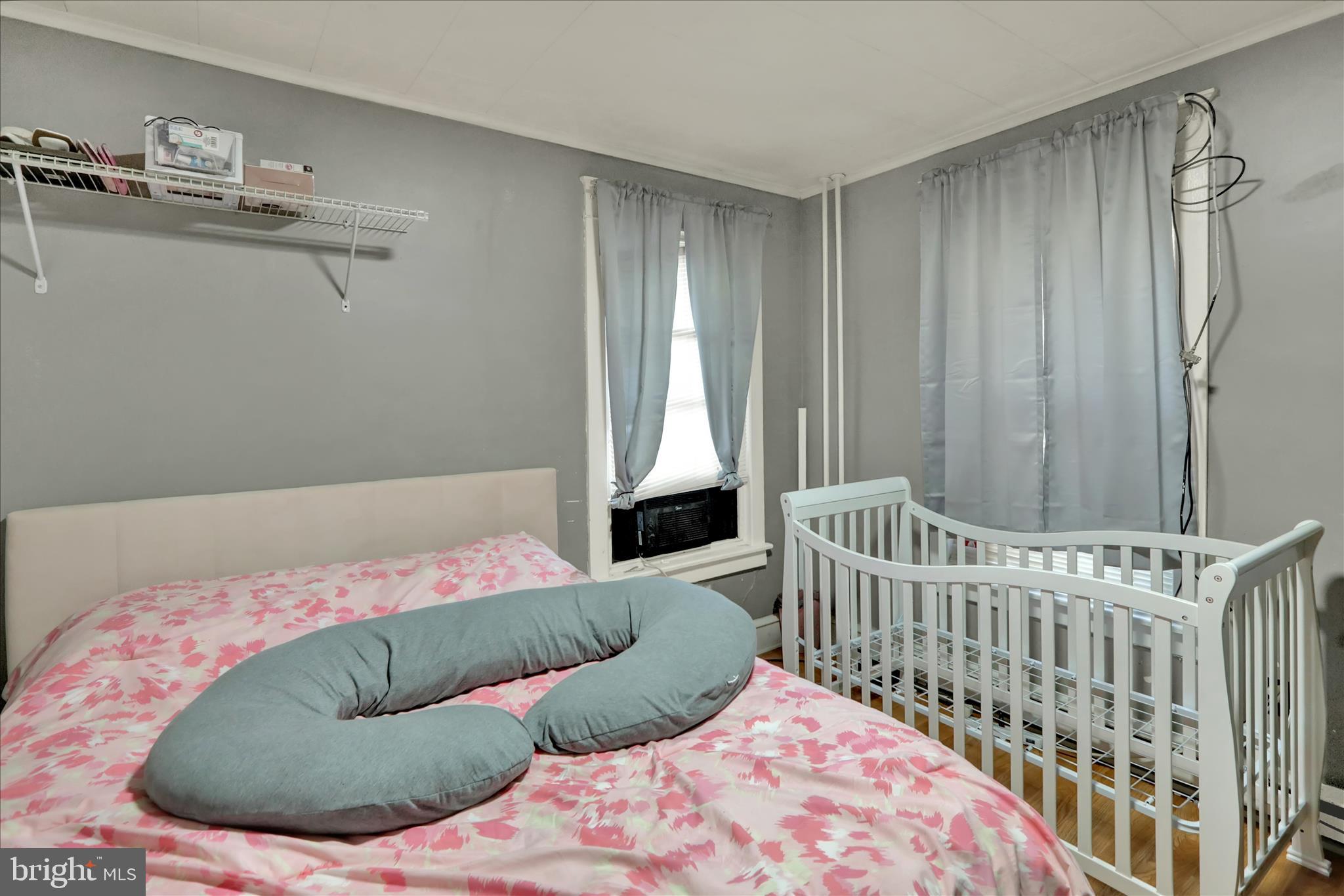 1410 Cotton Street Reading, PA 19602 - Photo 8 of 37 a bedroom with a bed and chair