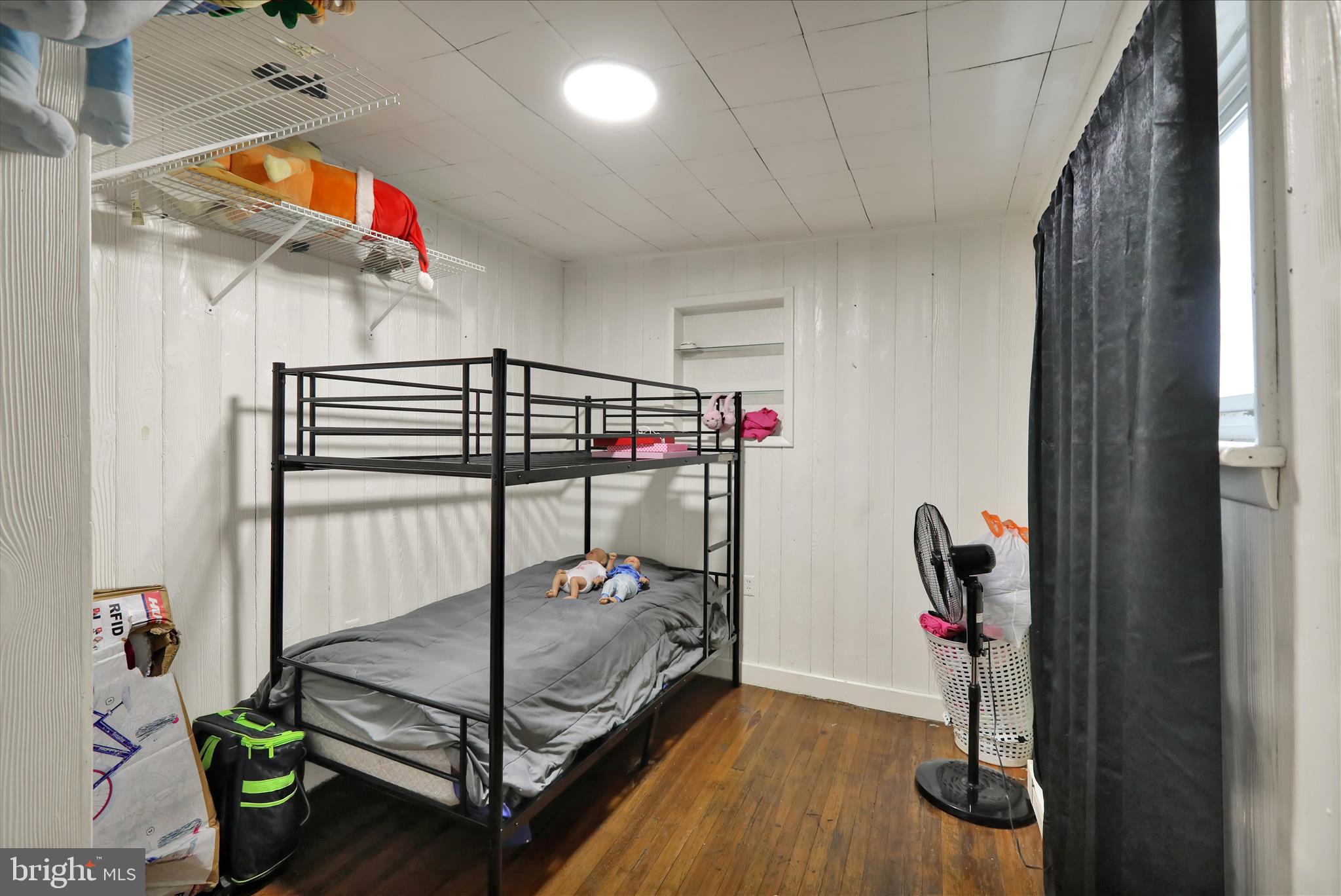 1410 Cotton Street Reading, PA 19602 - Photo 9 of 37 a bedroom with a bed and a chandelier