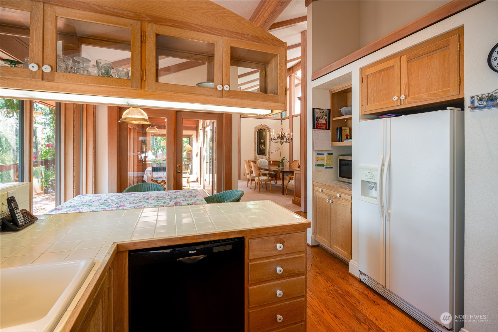 934 Mitchell Bay Road Friday Harbor, WA 98250 - Photo 11 of 40 a kitchen with a refrigerator and countertop