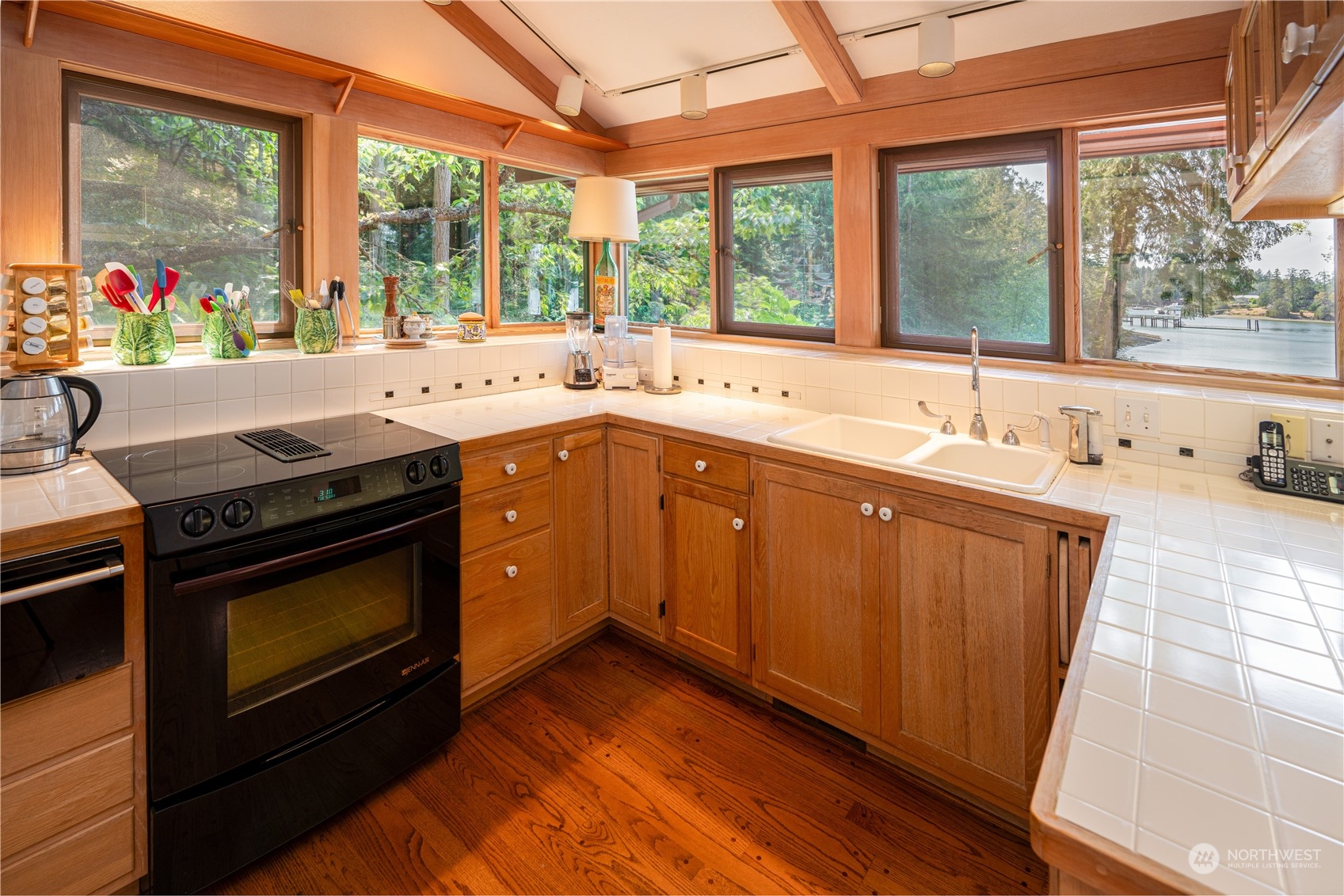 934 Mitchell Bay Road Friday Harbor, WA 98250 - Photo 12 of 40 a kitchen with a sink stove and cabinets