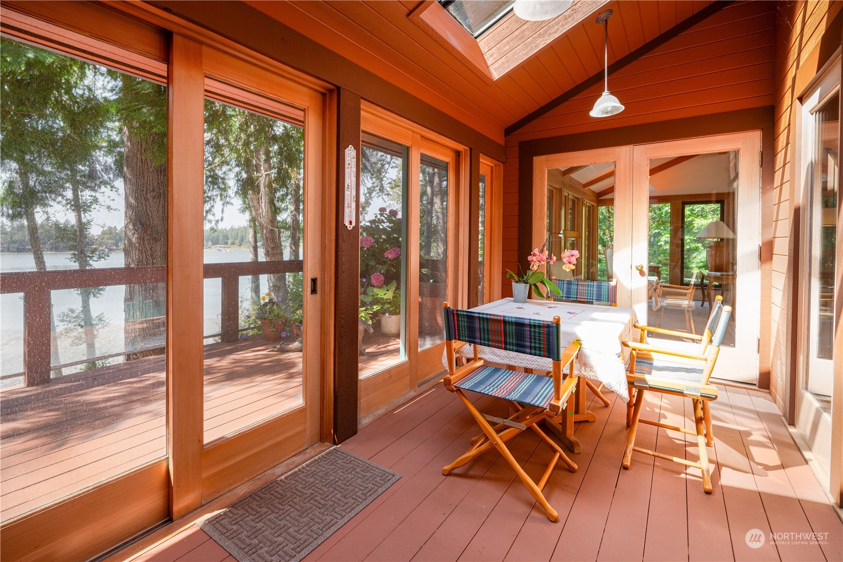 934 Mitchell Bay Road Friday Harbor, WA 98250 - Photo 13 of 40 a dining room with furniture and floor to ceiling windows