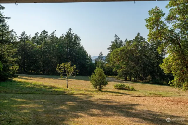 a swimming pool with an outdoor space and seating area