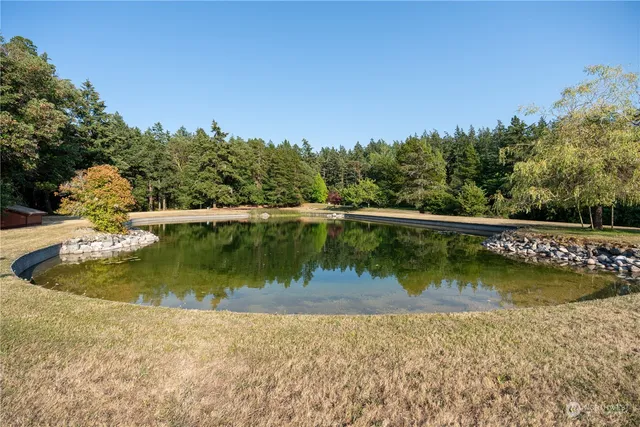 a view of a wooden floor and lake view