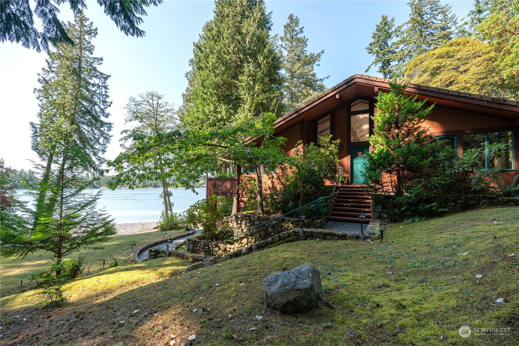 934 Mitchell Bay Road Friday Harbor, WA 98250 - Photo 4 of 40 a view of a house with backyard and sitting area