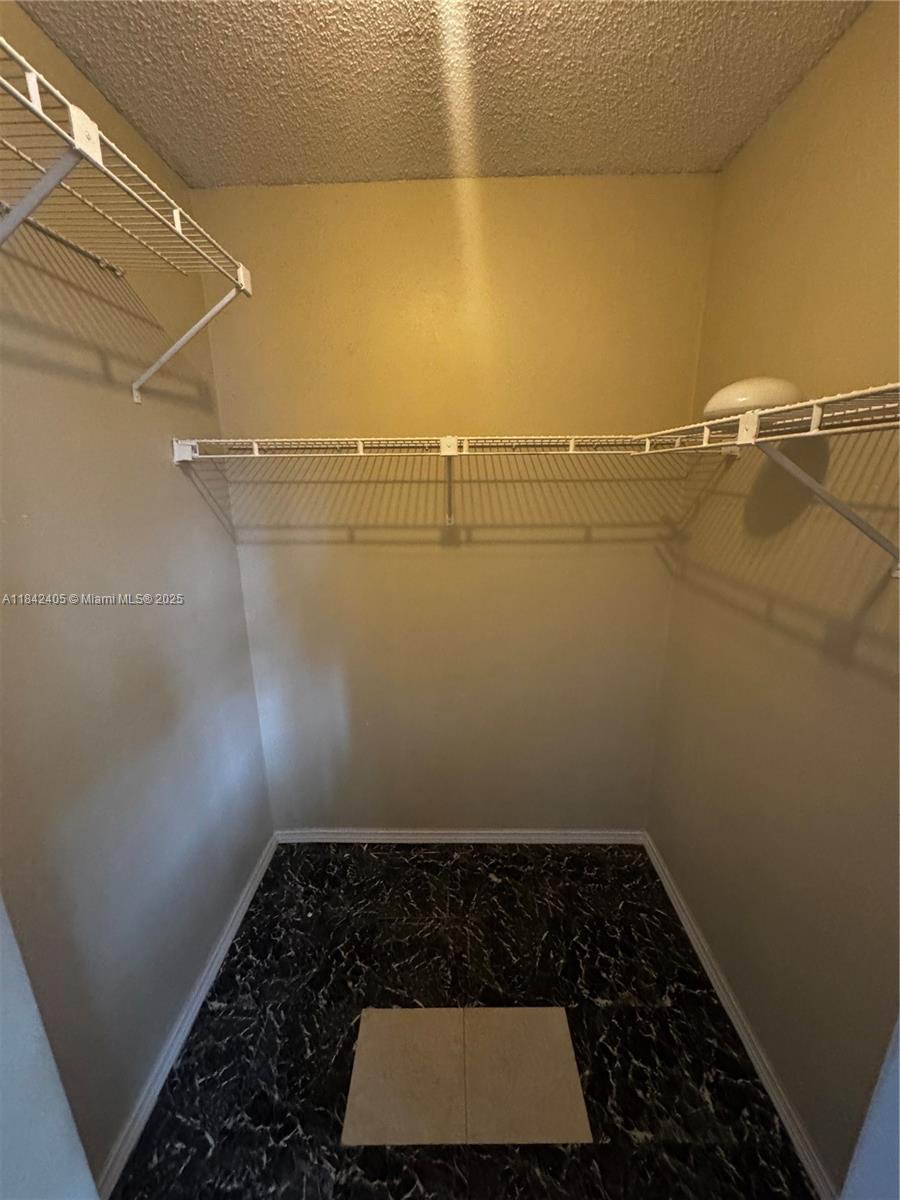 1227 Southwest 46th Avenue, Unit 314 Pompano Beach, FL 33069 - Photo 21 of 36 a bathroom with a shower