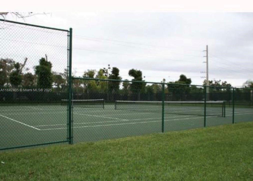 1227 Southwest 46th Avenue, Unit 314 Pompano Beach, FL 33069 - Photo 32 of 36 a view of a tennis court