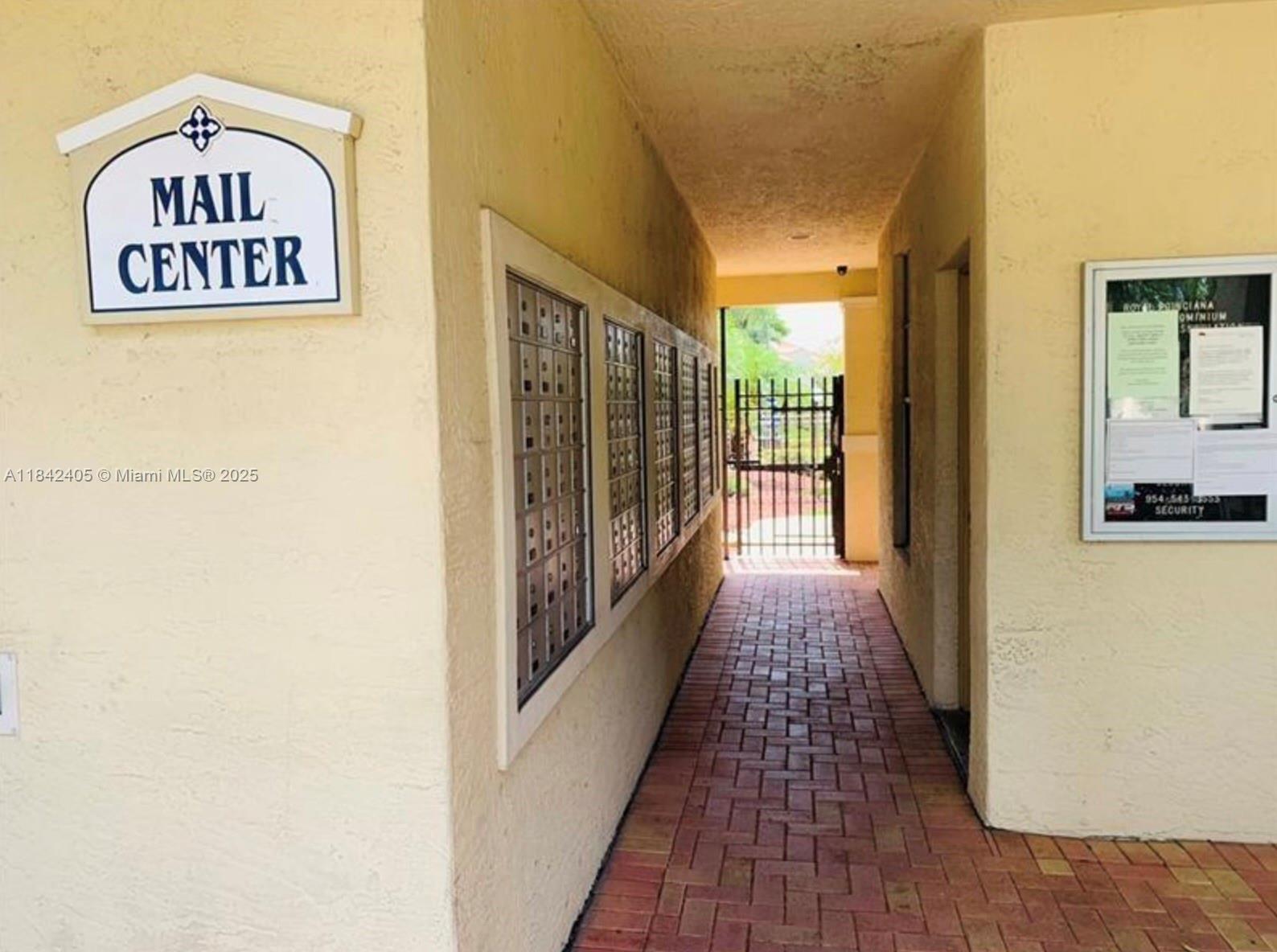 1227 Southwest 46th Avenue, Unit 314 Pompano Beach, FL 33069 - Photo 33 of 36 a view of a hallway with wooden floor