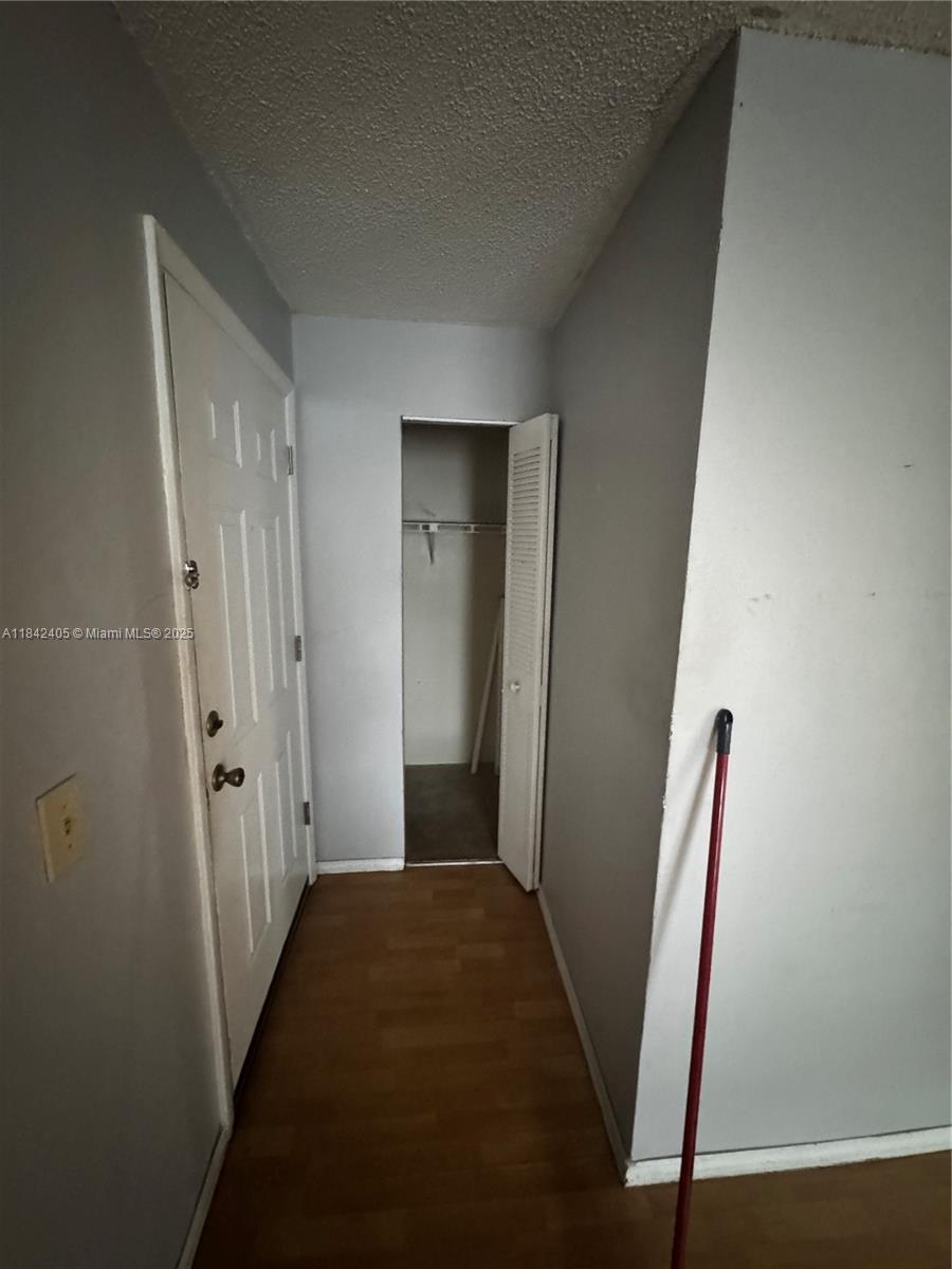 1227 Southwest 46th Avenue, Unit 314 Pompano Beach, FL 33069 - Photo 7 of 36 a view of room with window and wooden floor