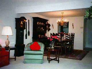 a living room view with furniture and lamp