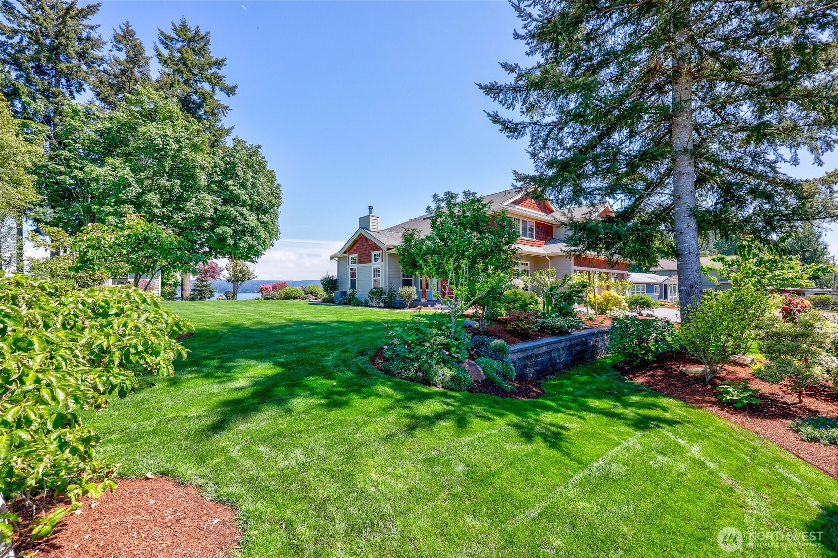 1411 Thorndyke Road Port Ludlow, WA 98365 - Photo 5 of 40 a garden with lots of plants and trees