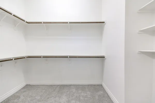 a view of an empty walk in closet