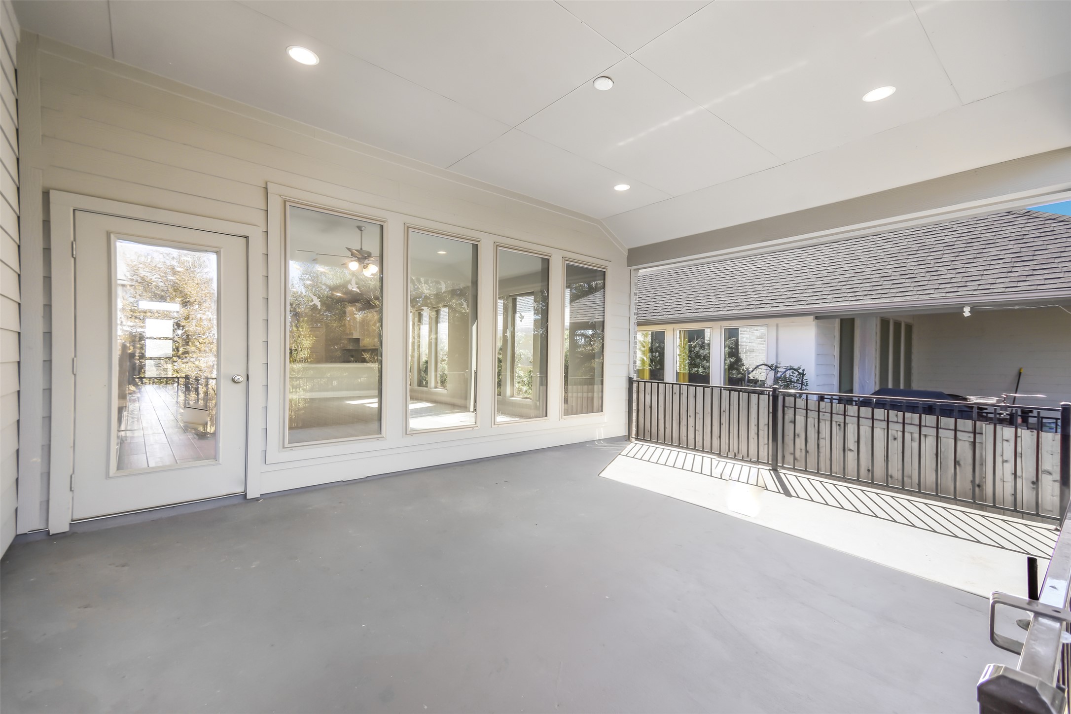 228 Pisa Lane Georgetown, TX 78628 - Photo 19 of 28 a view of an empty room and floor to ceiling window and wooden floor