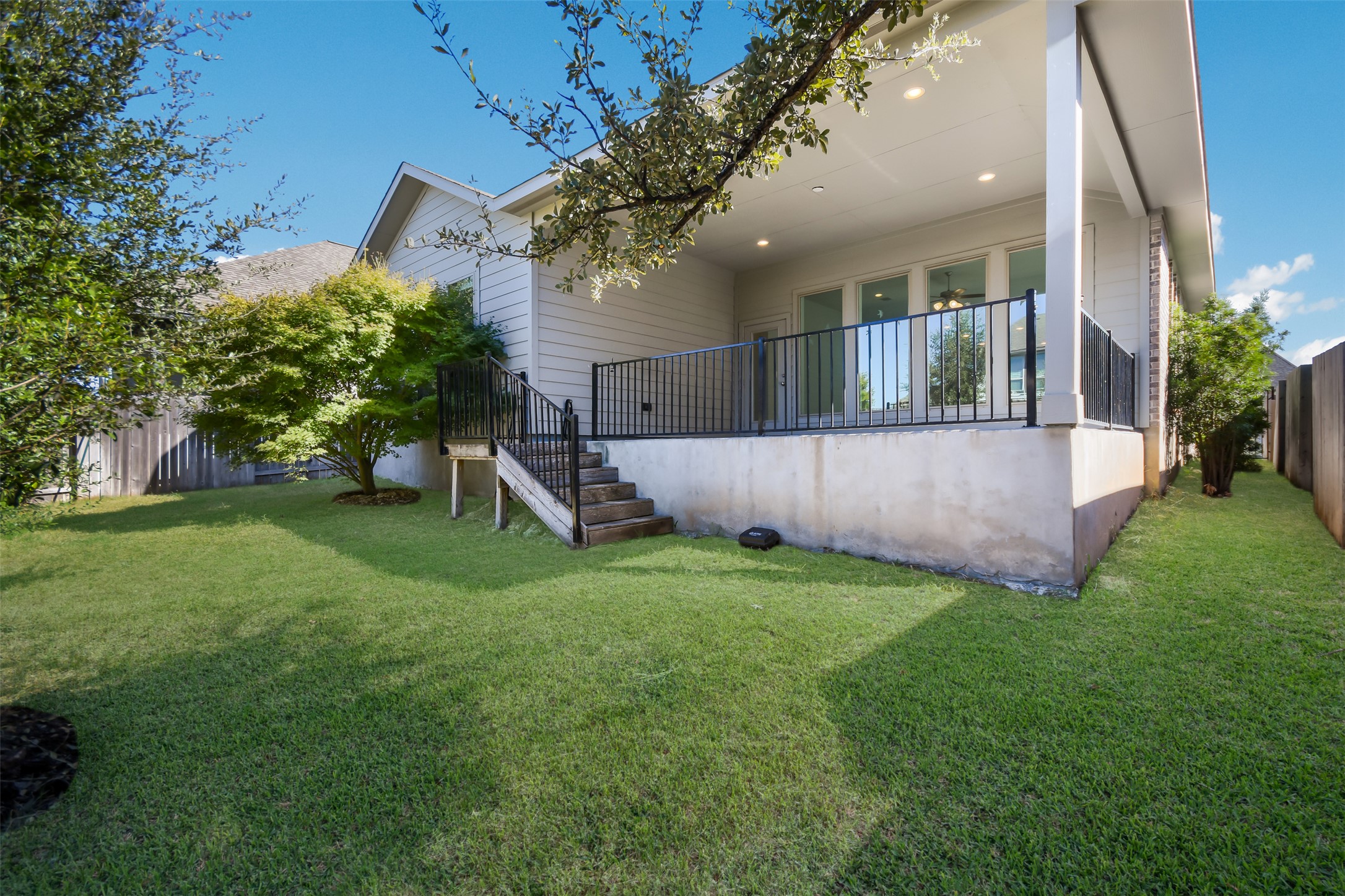 228 Pisa Lane Georgetown, TX 78628 - Photo 20 of 28 a view of a house with a yard and a large tree