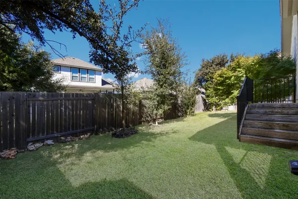 a view of a backyard with green space