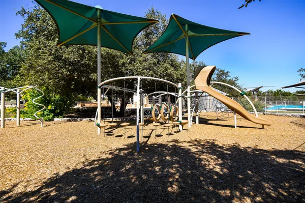 a view of a park with a slide
