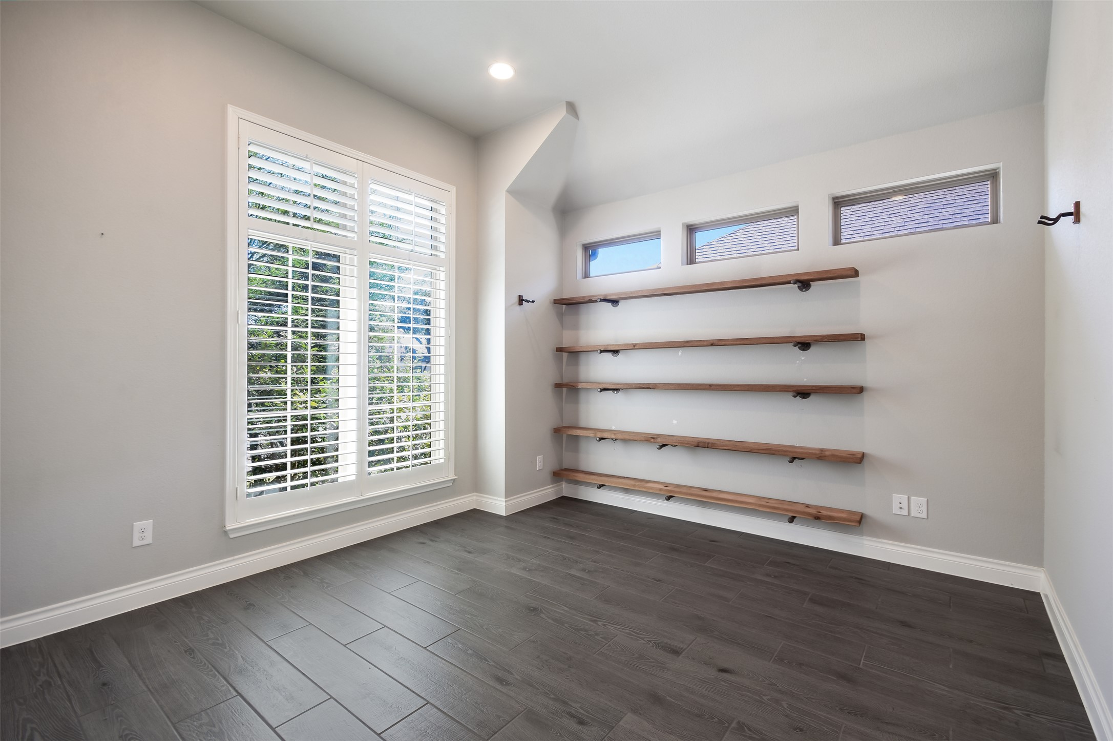 228 Pisa Lane Georgetown, TX 78628 - Photo 8 of 28 a view of room with wooden floor and windows