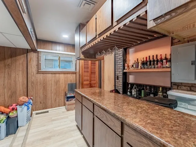 a kitchen with a sink and cabinets