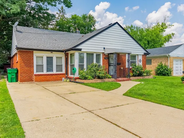 front view of a house and a yard