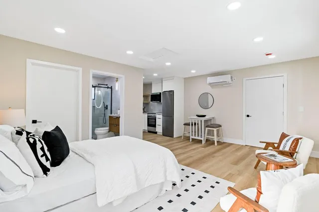 a kitchen with stainless steel appliances a stove a microwave and cabinets