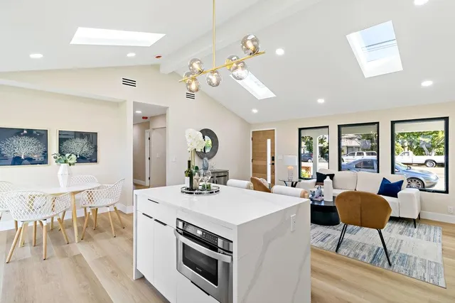 a kitchen with cabinets a sink and appliances