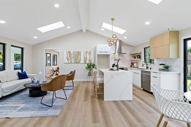 a bedroom with a bed and a large mirror