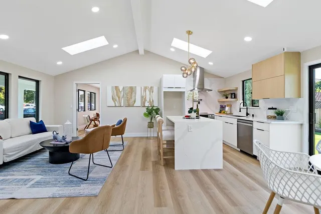 a bedroom with a bed and a large mirror