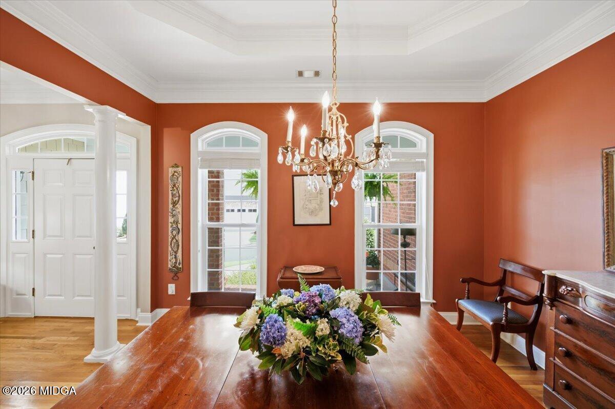 210 Oberon Place Macon, GA 31210 - Photo 6 of 31 a hallway with wooden floor potted plant and a chandelier