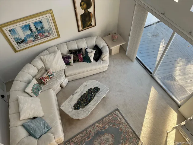 a living room with furniture and a rug